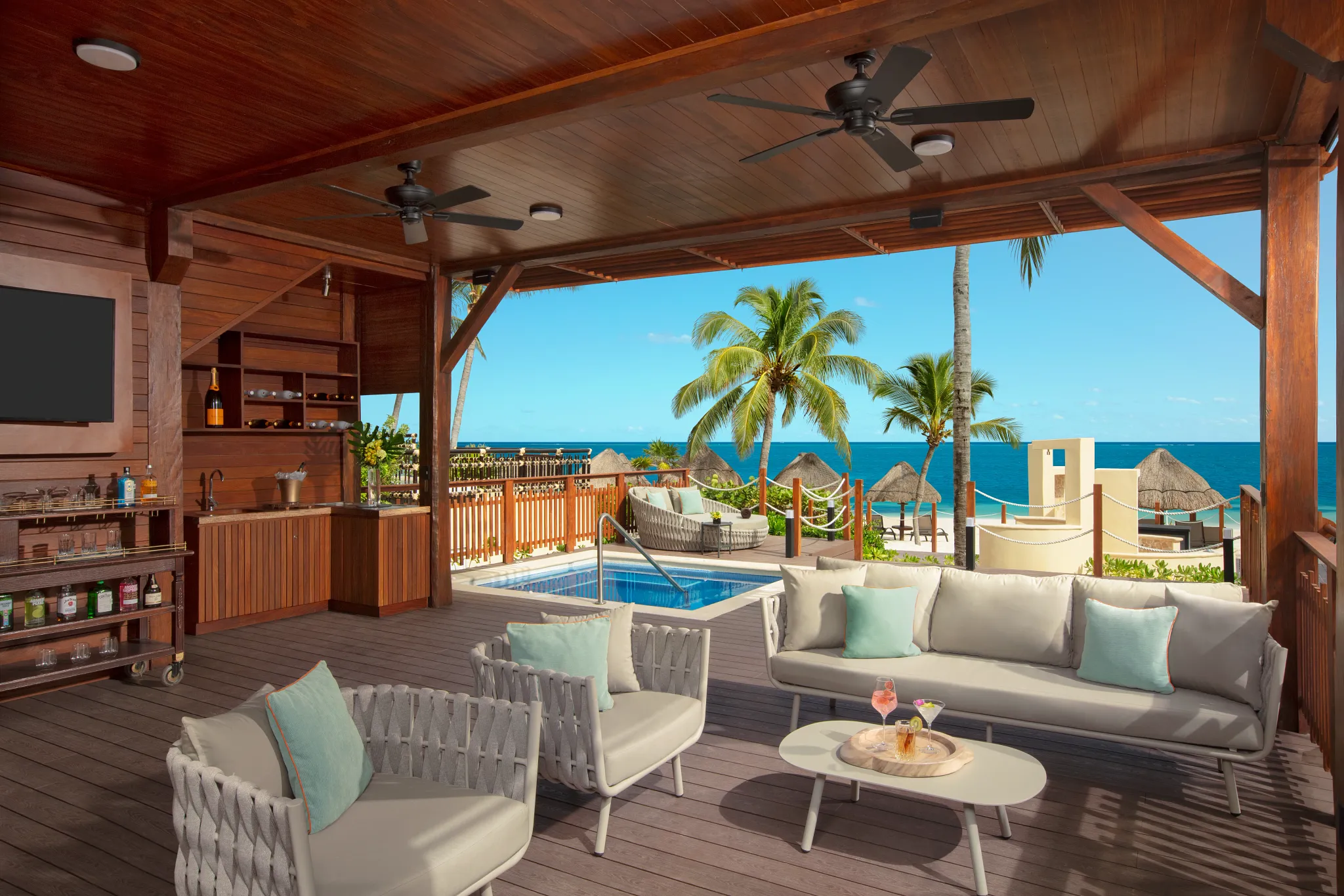 Private beach cabana with ocean views and plunge pool at Dreams Riviera Cancun Resort & Spa, perfect for relaxing luxury getaways.