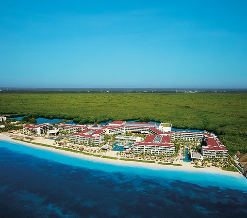 Breathless Riviera Cancun adults-only all-inclusive resort with vibrant pool parties, beachfront setting, and high-energy social atmosphere.