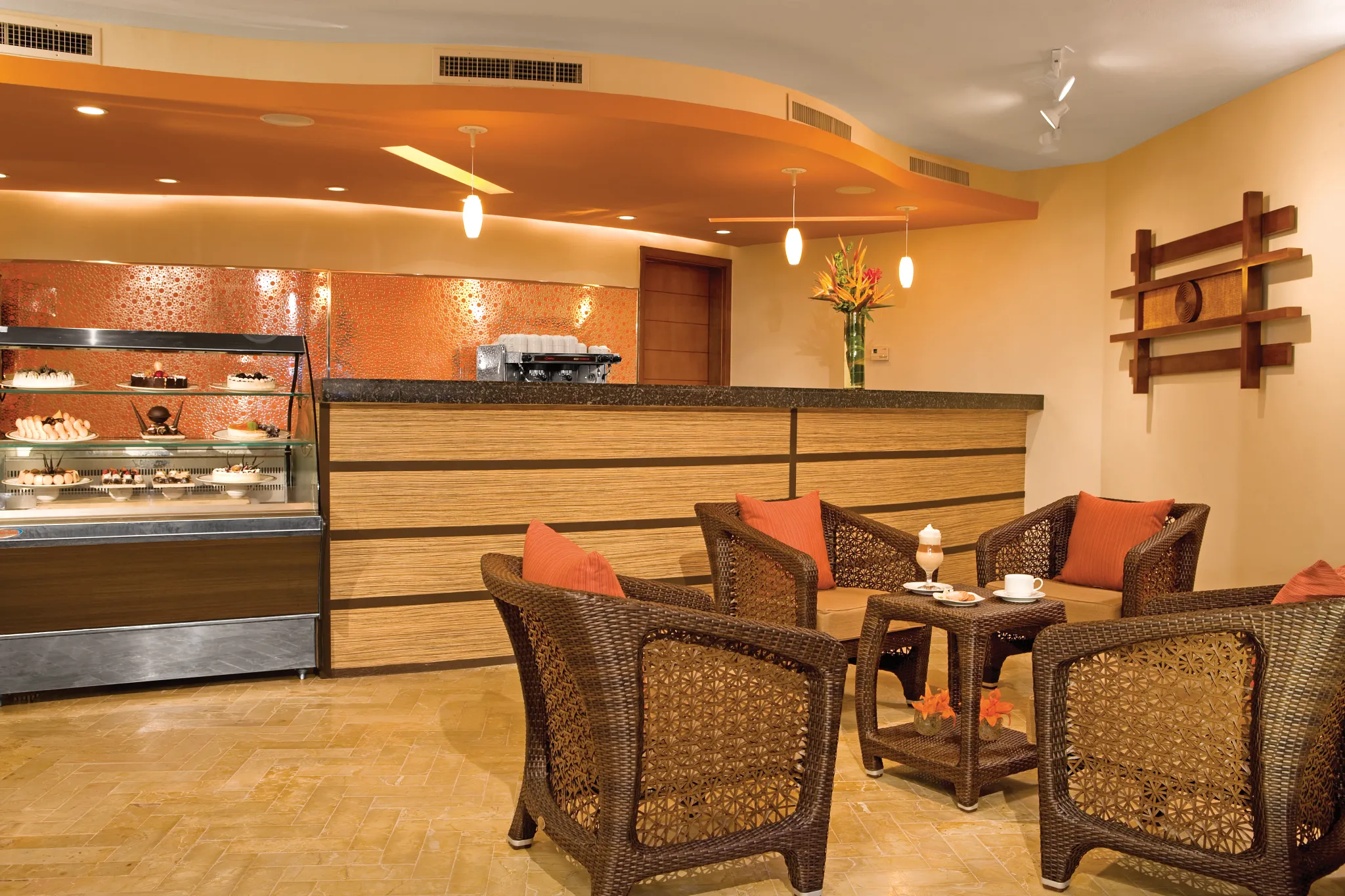 Coco Café at Dreams Riviera Cancun Resort & Spa featuring a cozy coffee bar, premium espresso drinks, pastries, and casual lounge seating.