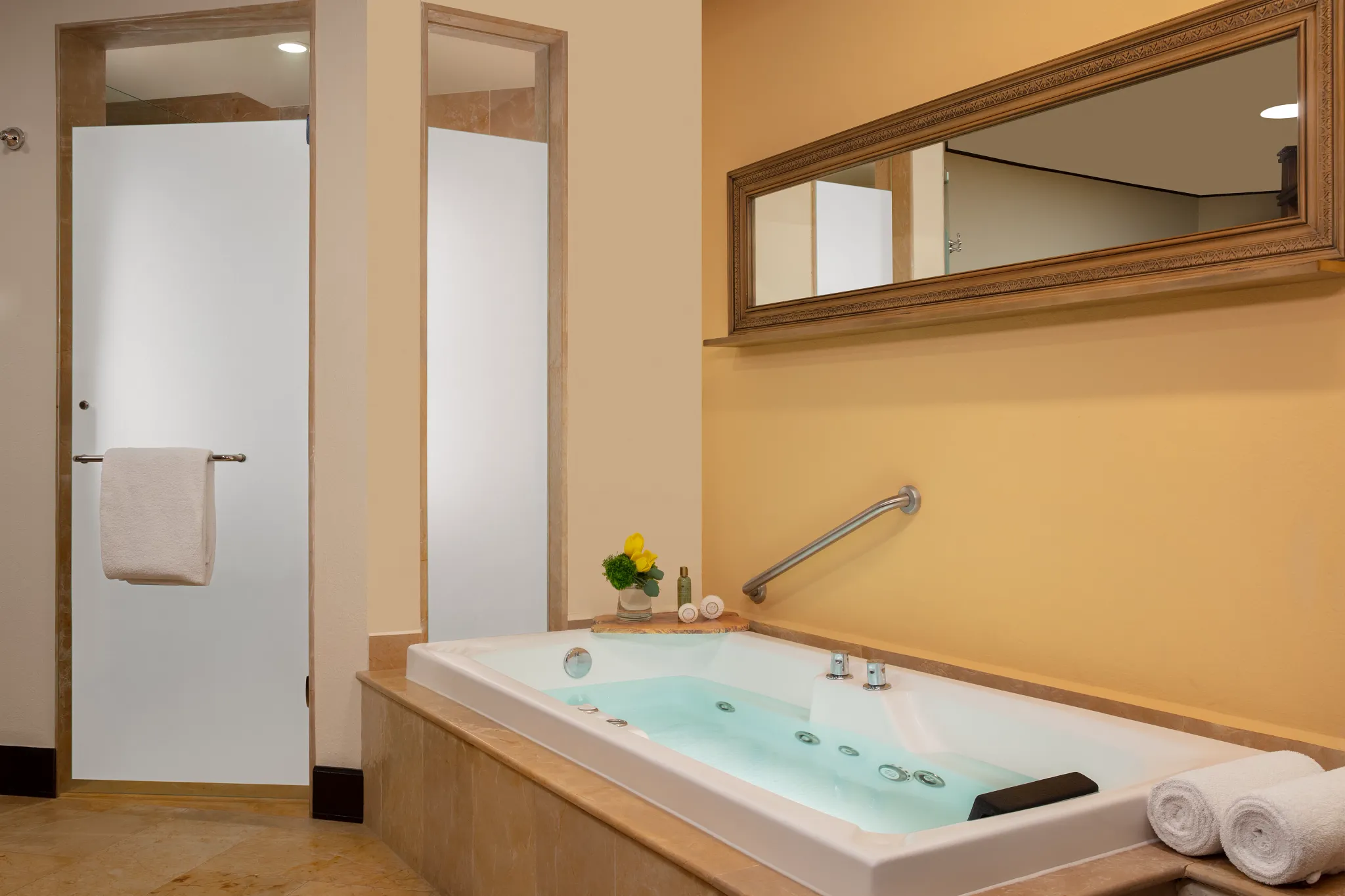 Family Suite Preferred bathroom with indoor jetted hot tub and walk-in shower at Dreams Riviera Cancun Resort & Spa.