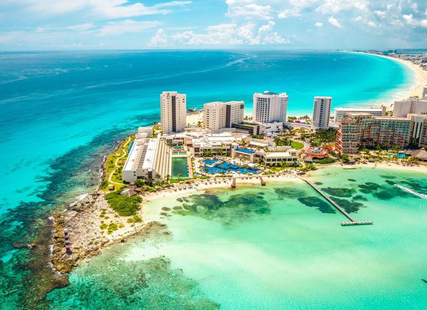 Hyatt Ziva Cancun all-inclusive family resort in Cancun Hotel Zone with oceanfront infinity pools, white sand beach, and turquoise Caribbean waters.