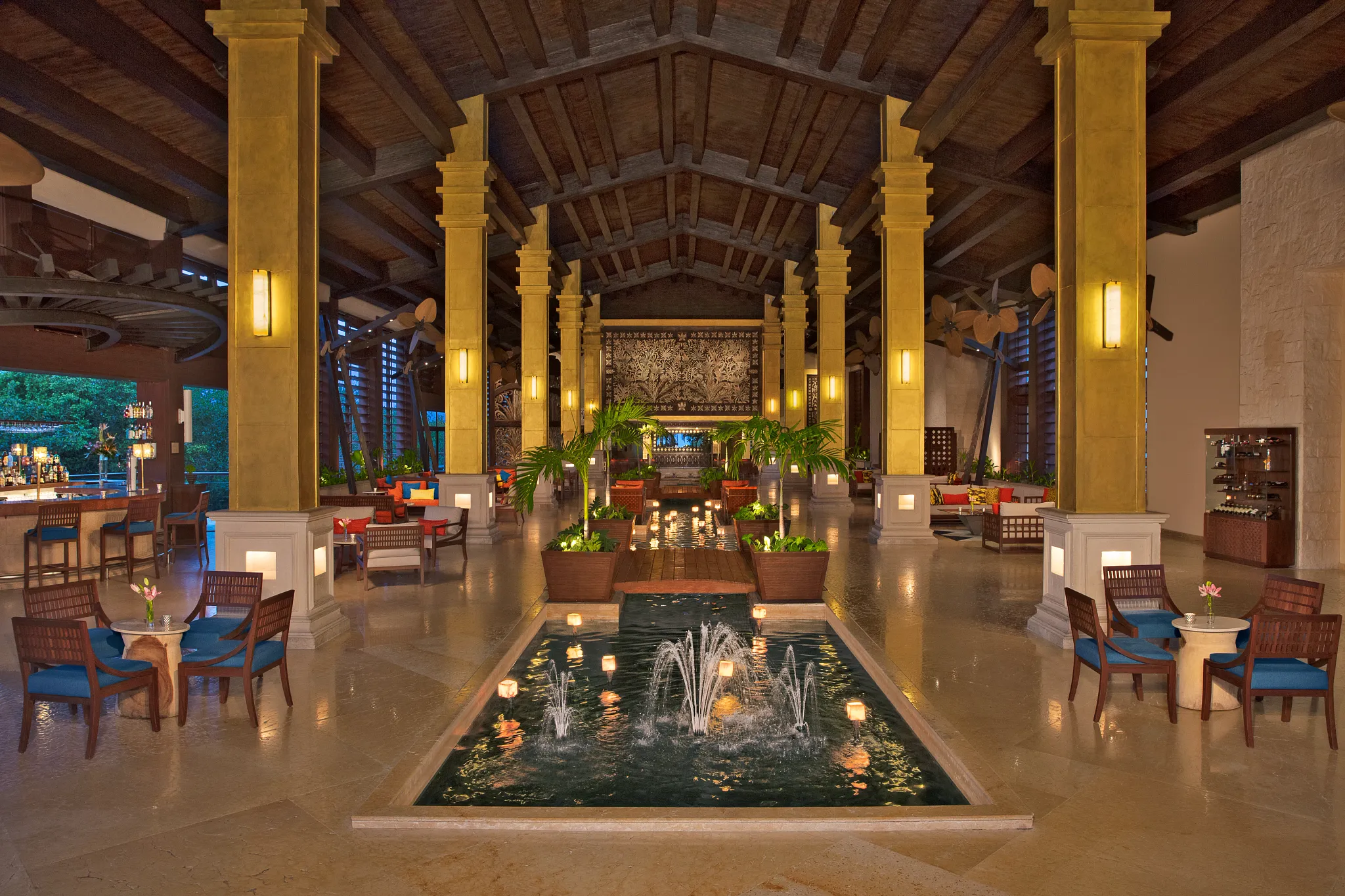 Spacious open-air lobby with fountain and seating at Dreams Riviera Cancun Resort & Spa.