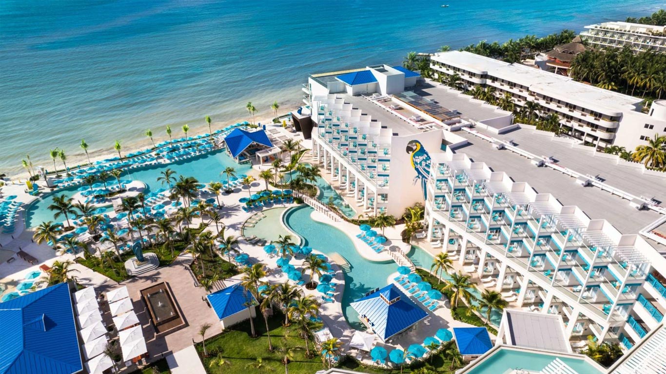 Margaritaville Island Reserve Riviera Cancun all-inclusive resort with vibrant pools, beachfront setting, and tropical party atmosphere near Puerto Morelos.