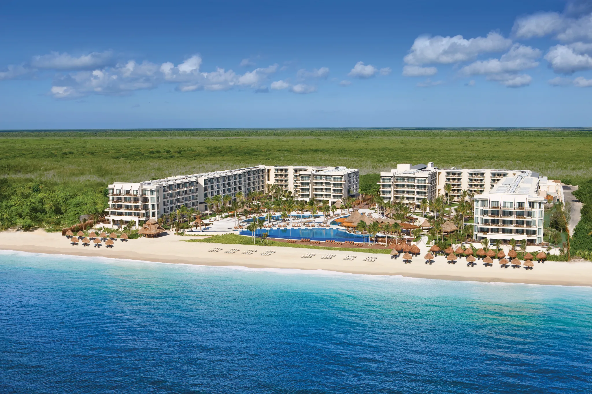 Panoramic aerial view of Dreams Riviera Cancun Resort & Spa along the Riviera Maya coastline.