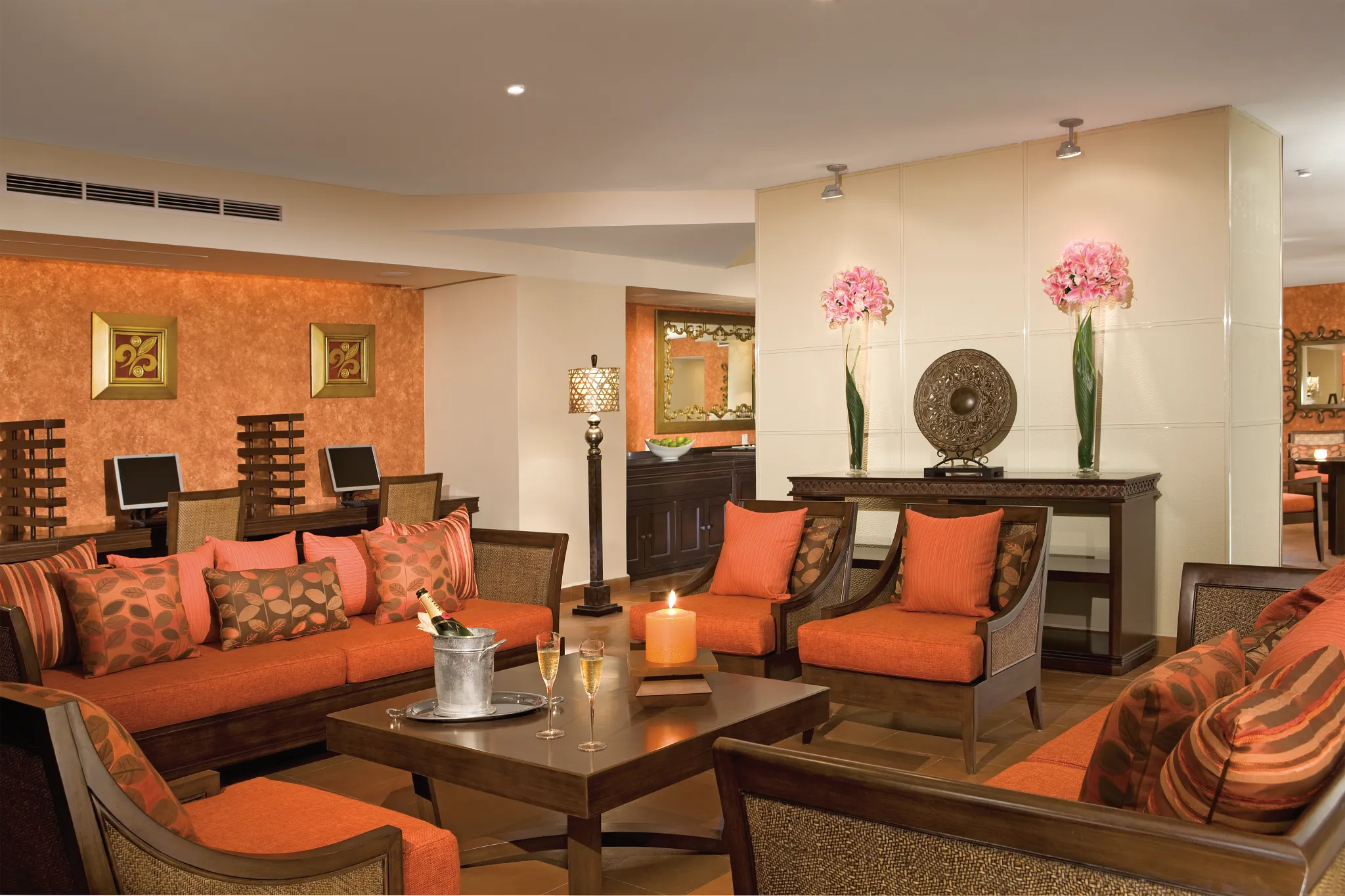 Elegant Preferred Club lounge seating area with champagne service at Dreams Riviera Cancun Resort & Spa.