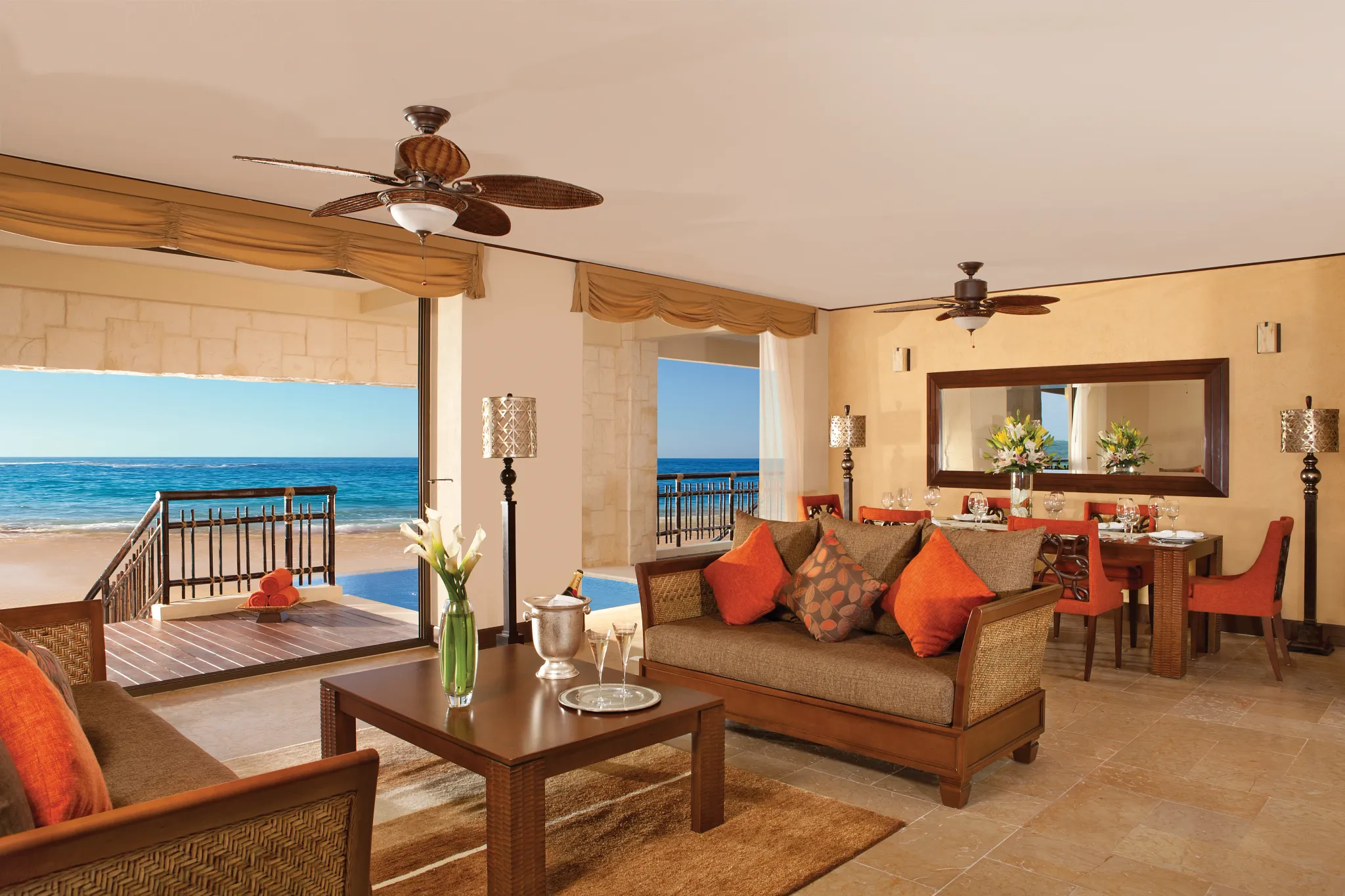 Preferred Club Ocean Front Presidential Suite living and dining area with ocean view at Dreams Riviera Cancun Resort & Spa.