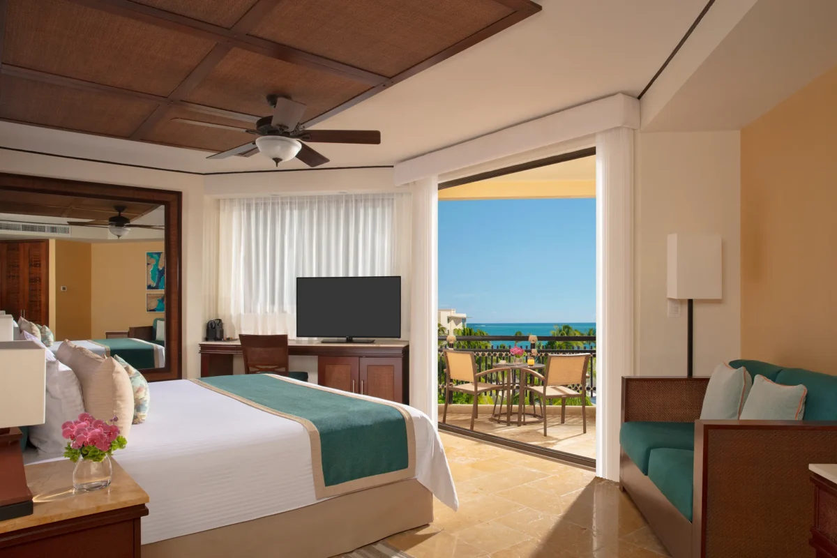 Preferred Club Ocean View king room with balcony overlooking the ocean at Dreams Riviera Cancun.