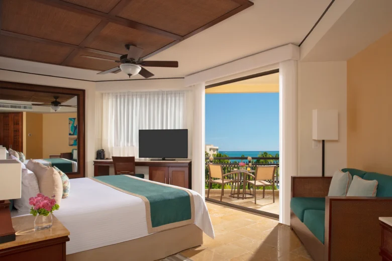 Preferred Club Ocean View king room with balcony overlooking the ocean at Dreams Riviera Cancun.