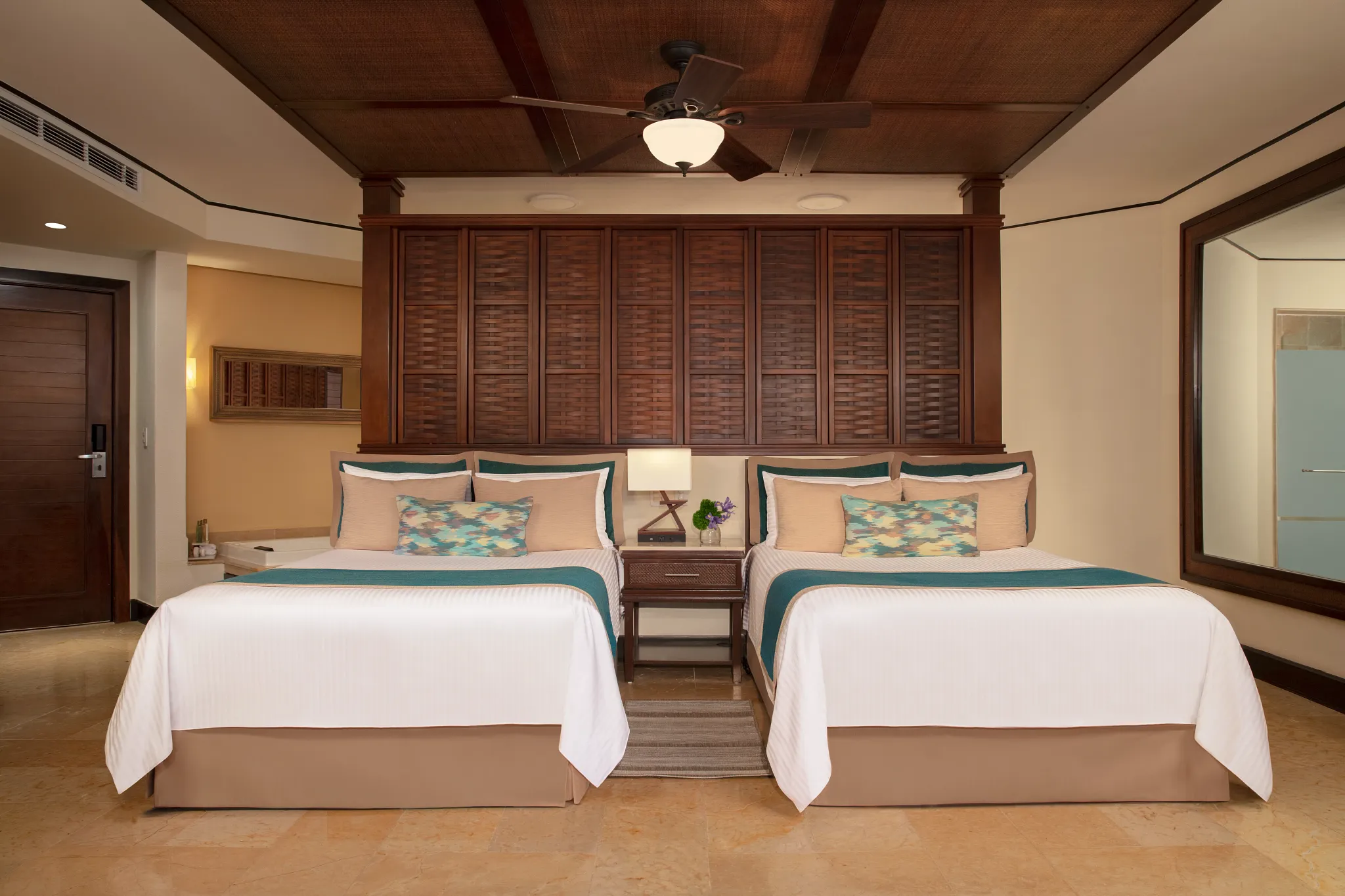 Preferred Club Ocean View & Pool Front room with two double beds at Dreams Riviera Cancun.