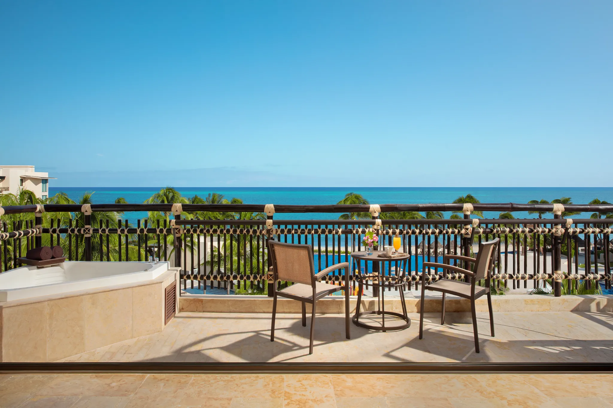 Preferred Club Ocean View & Pool Front terrace with outdoor hot tub and ocean view at Dreams Riviera Cancun.
