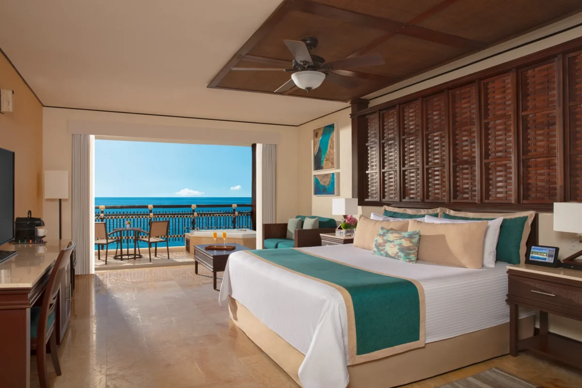 Preferred Club Ocean Front Honeymoon Suite king bedroom at Dreams Riviera Cancun