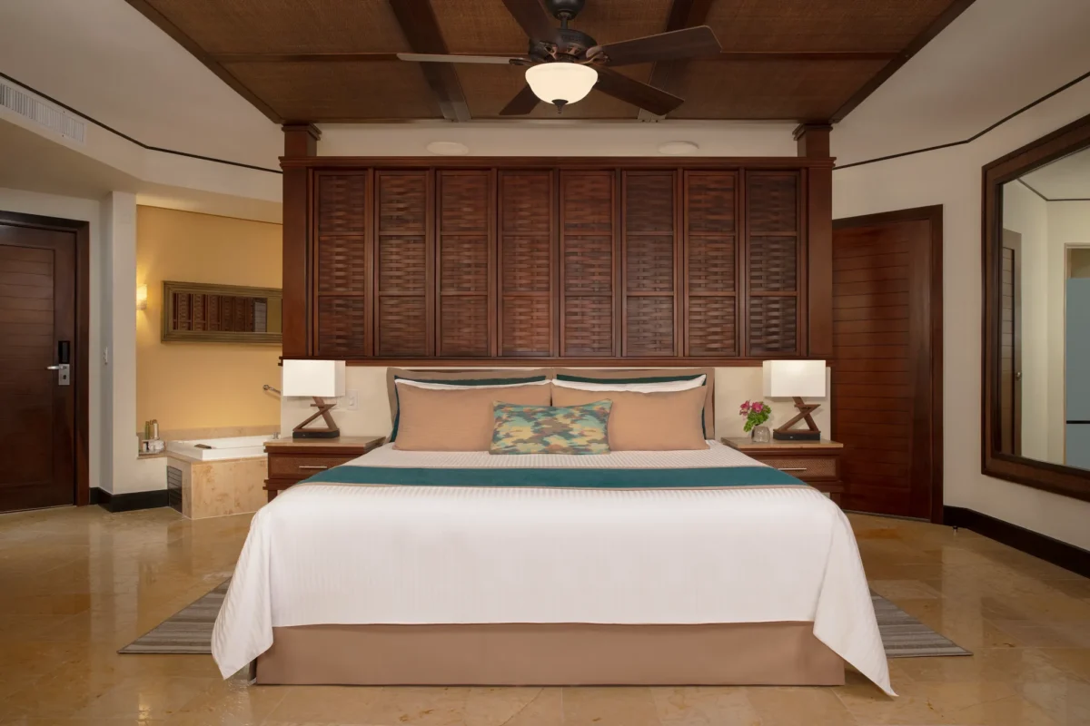Premium Deluxe Garden View room with king bed and indoor hot tub at Dreams Riviera Cancun Resort & Spa.