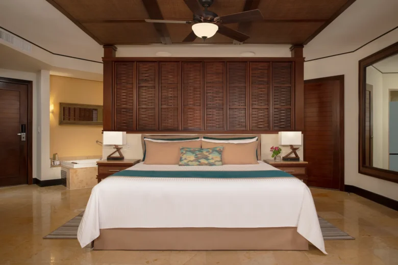 Premium Deluxe with plunge pool room featuring king bed and indoor hot tub at Dreams Riviera Cancun.