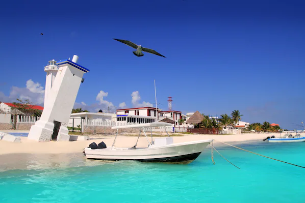 Puerto Morelos Beach near Dreams Riviera Cancun Resort & Spa with white sand and clear Caribbean waters