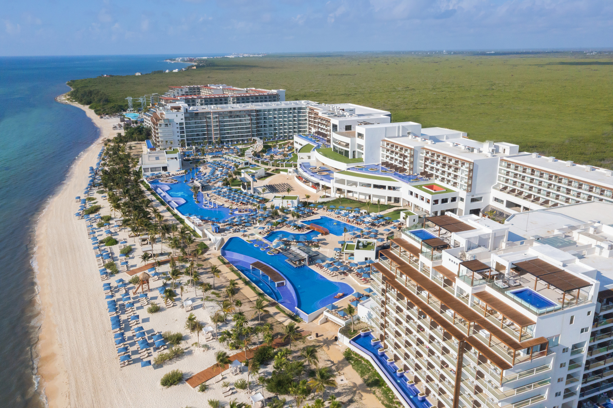 Royalton Riviera Cancun all-inclusive resort with expansive pools, modern architecture, and beachfront setting on the Riviera Maya.