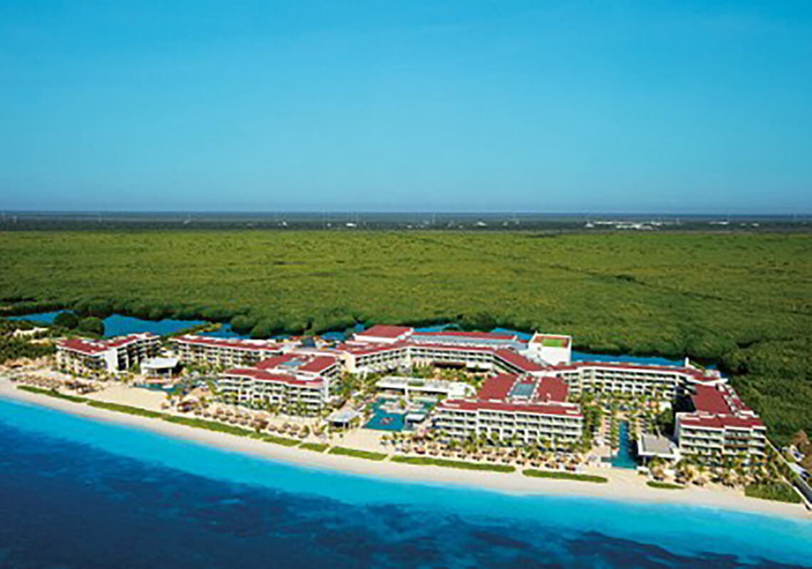Secrets Riviera Cancun adults-only all-inclusive resort in Puerto Morelos with elegant pools, romantic atmosphere, and Caribbean beachfront.